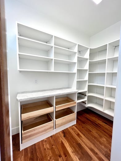 Walk-in pantry with pull out drawers.