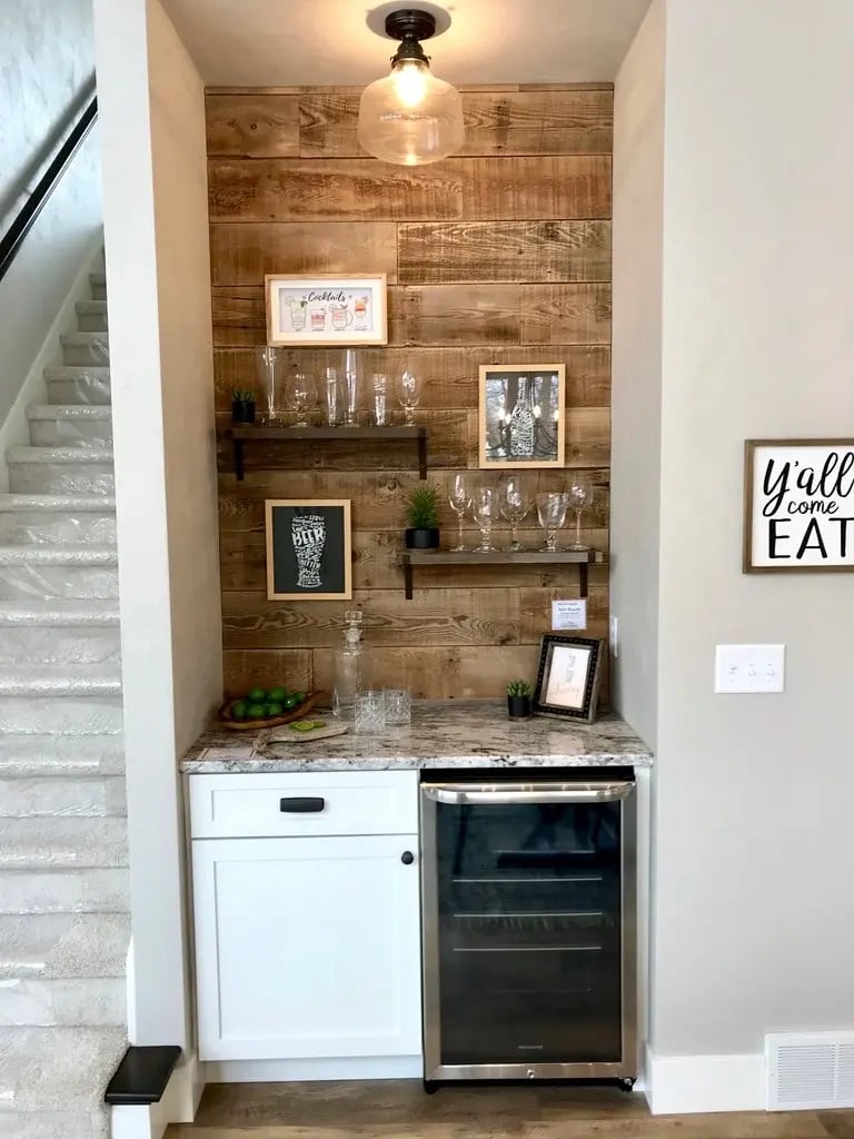 Beverage center with wood plank accent wall.