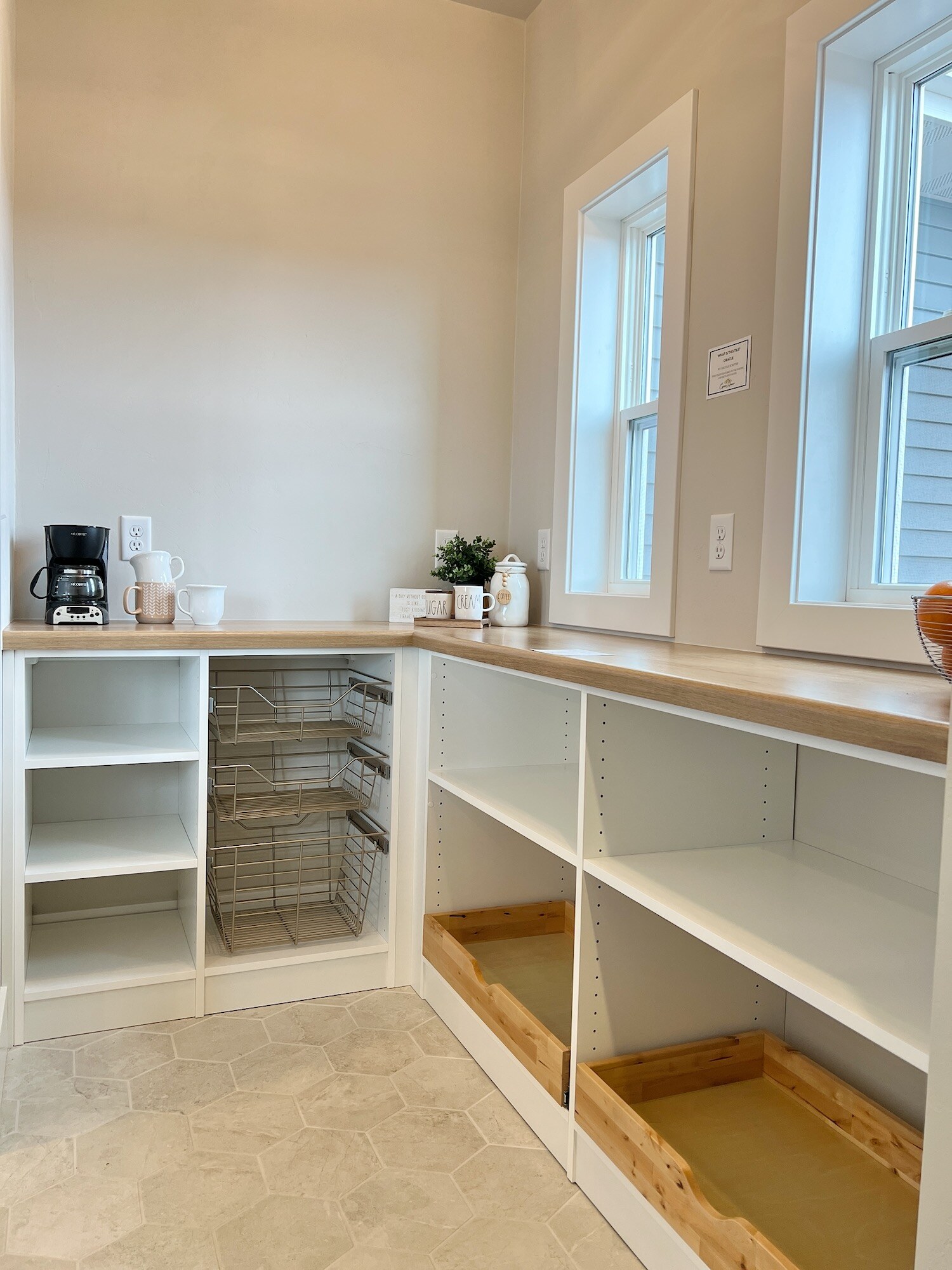 Walk-in Pantry with coffee center and tile flooring.