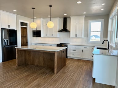 Oak Wood island with white countertop.