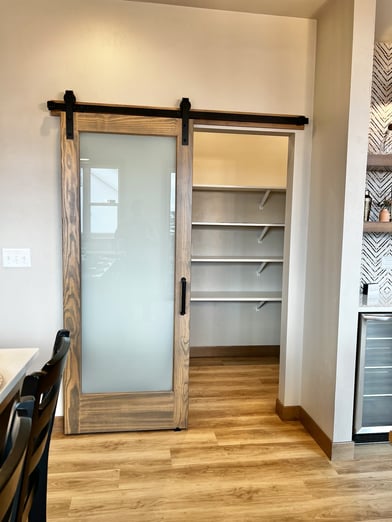 Pantry with sliding door.